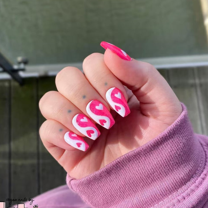 Artificial nails with heart motif and floral accents Stornfield