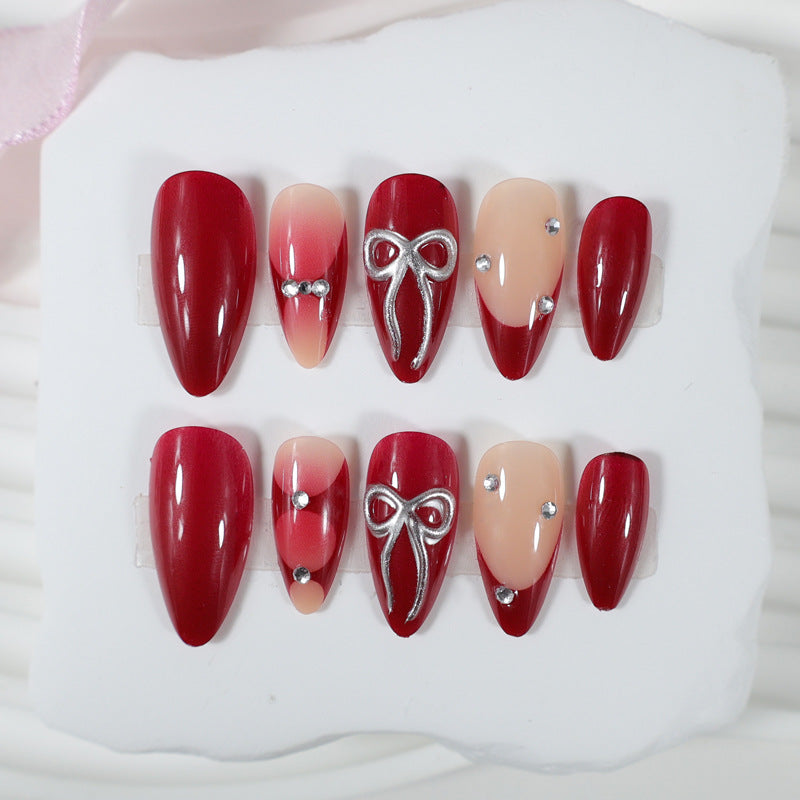 Artificial nail set with luxurious glitter and gemstone embellishments Stornfield