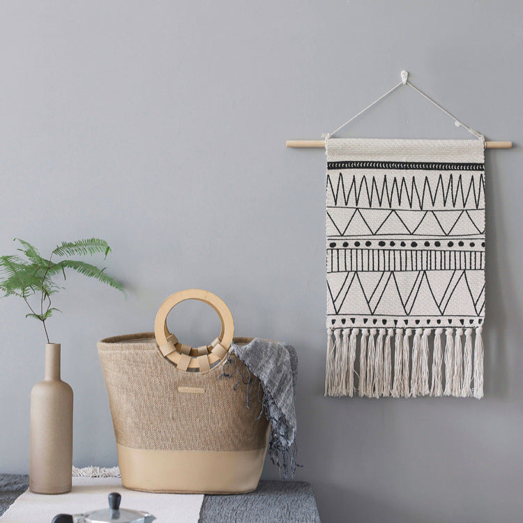 Woven Boho wall hanging with fringes and graphic ethnic pattern Stornfield