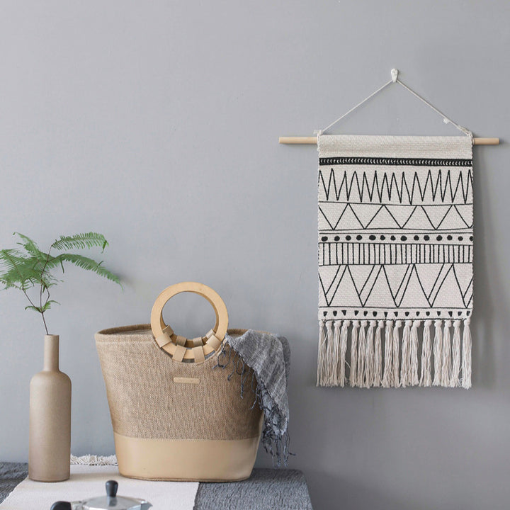 Woven Boho wall hanging with fringes and graphic ethnic pattern Stornfield