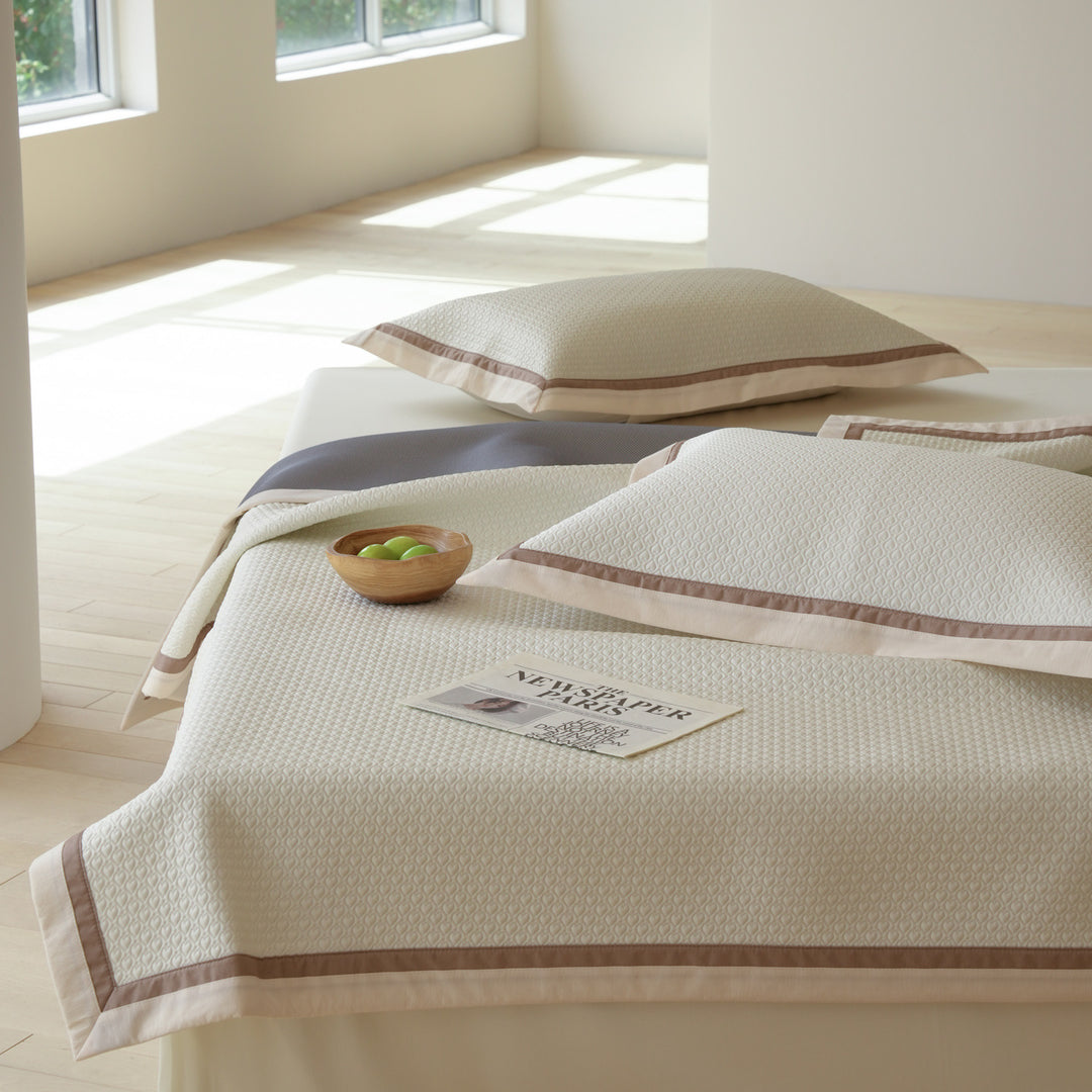 Quilted bedspread with textured waffle pattern and pillowcases