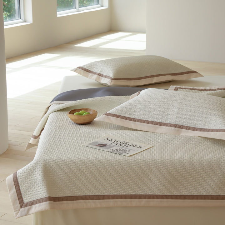 Quilted bedspread with textured waffle pattern and pillowcases