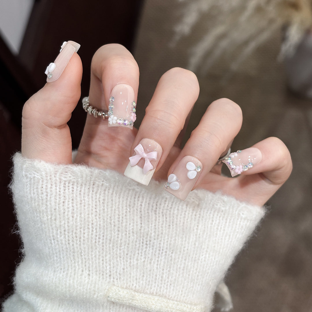 Decorative Nail Art Set with Floral Details and Bow Accents