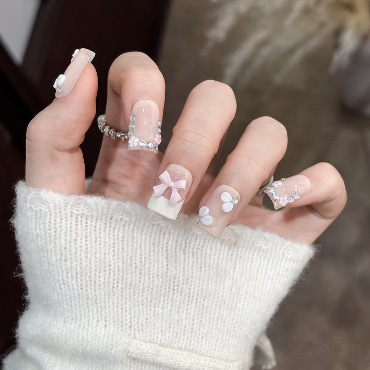 Decorative Nail Art Set with Floral Details and Bow Accents