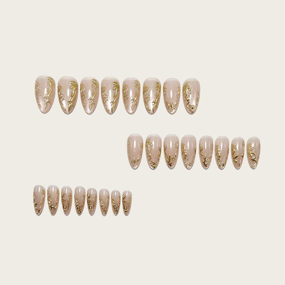 Exquisite artificial nails with golden decorations Stornfield