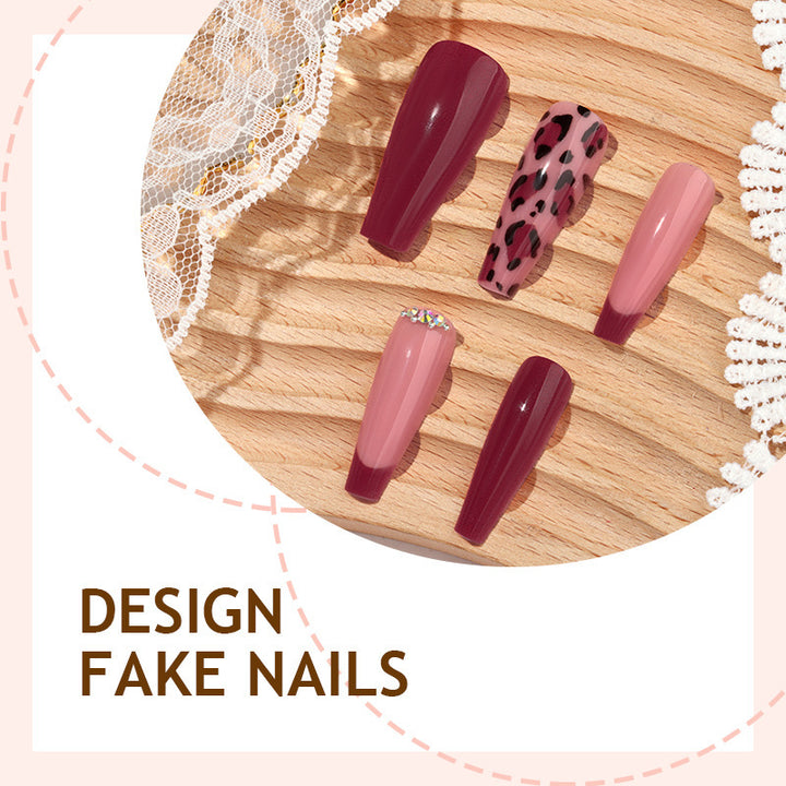 Artificial nail set with elegant animal print and glitter accents Stornfield
