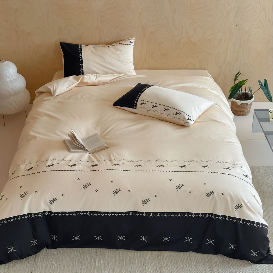 Satin bedding set with embroidered horse and leaf border
