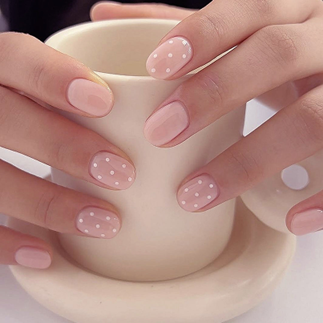 Artful stiletto nails with elegant floral design and glitter details Stornfield