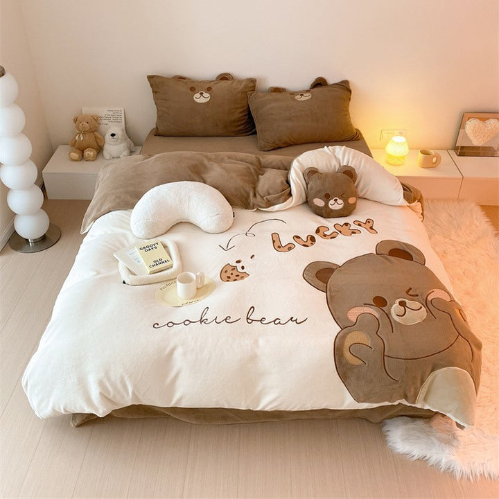 Cozy reversible bedding set with embroidered duck motif, appliqués, and Stornfield cuddle pillow