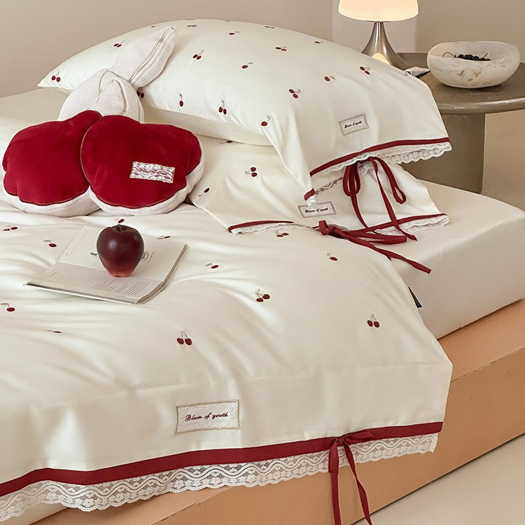 Romantic cotton satin duvet cover set with embroidered cherries, lace trim, and ties