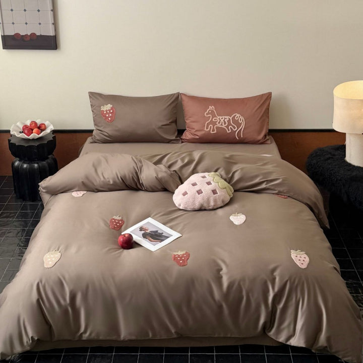 Bedding set with embroidered strawberry appliqués and silky matte satin look