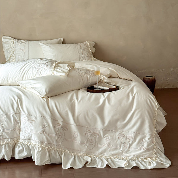 Luxurious embroidered bedding set with ruffle and pillowcases