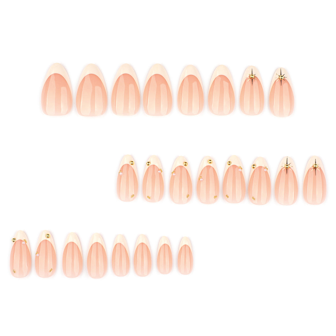 Artistic French-tip nail art with glitter and elegant embellishments Stornfield