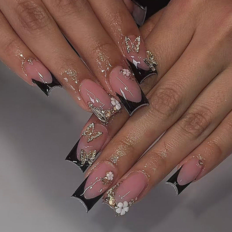 Creative nail art set with romantic floral designs and glamorous accents Stornfield