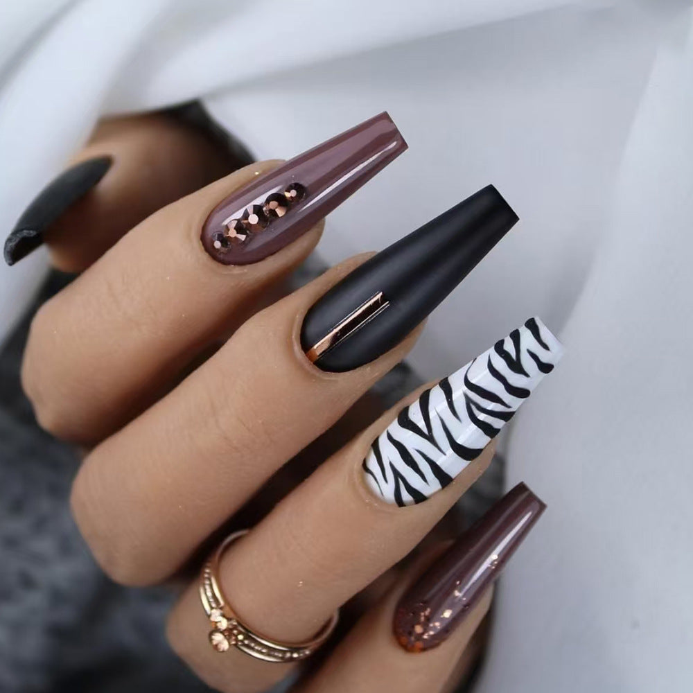 Artistic Stiletto Press-On Nail Art with Zebra Print Stornfield