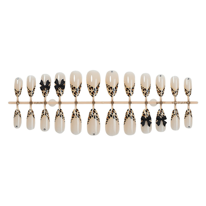 Creative nail set with leopard design and glitter accents Stornfield