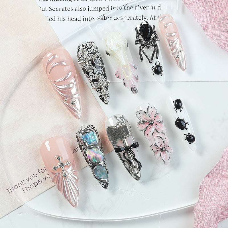 Creative nail art set with Halloween motifs and intricate details Stornfield