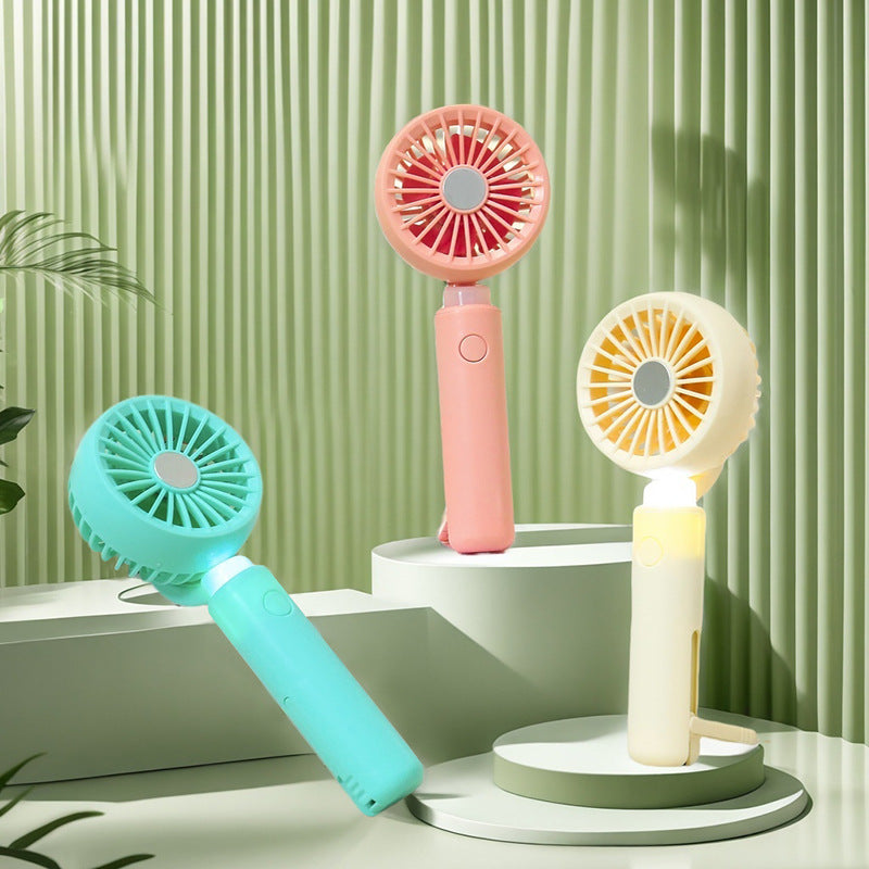 Women portable mini hand fan with integrated LED lighting and USB charging function Stornfield