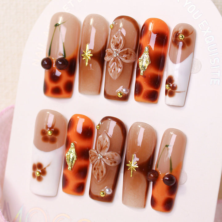 Acrylic nail set with luxurious decorations and stylish accents Stornfield