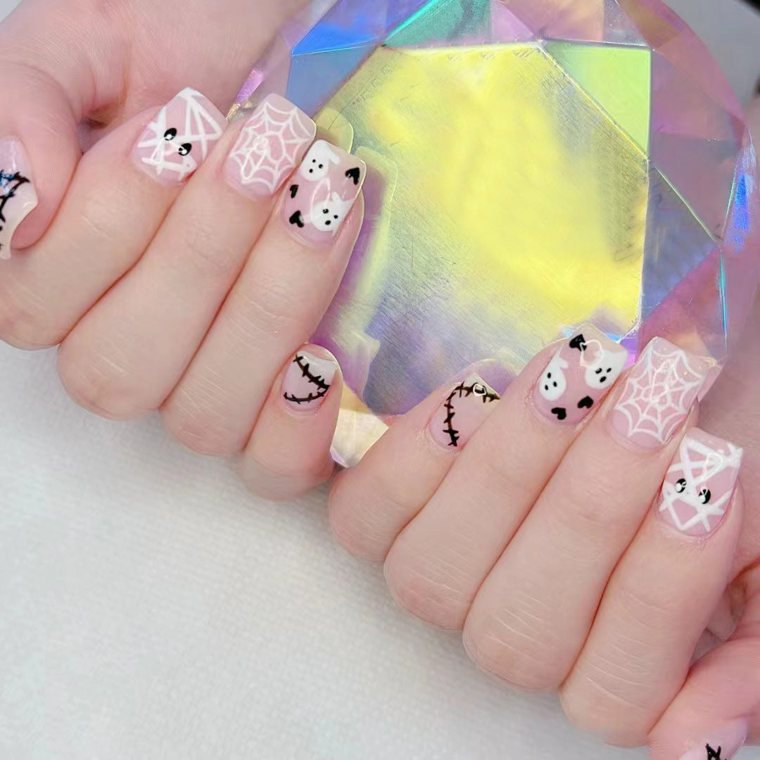 Halloween-Themed Ghost and Spider Nail Art