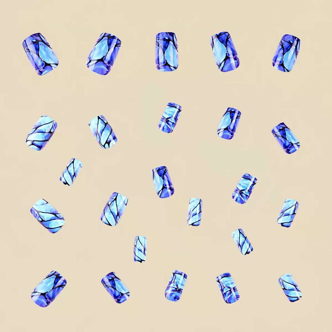 Acrylic nail set with luxurious marble design and elegant accents Stornfield