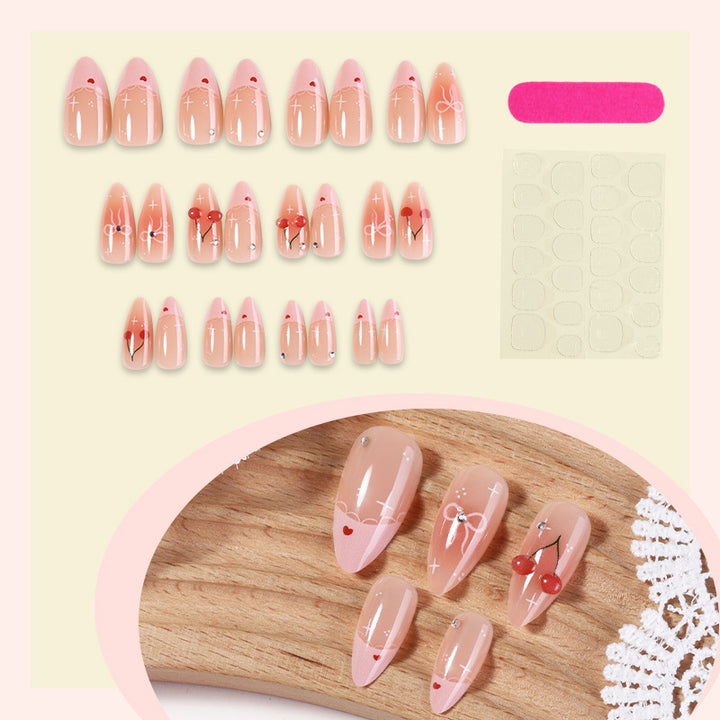 Artifical nails with playful heart and bow designs Stornfield