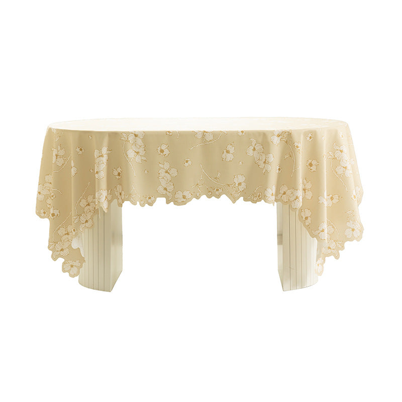 Round wipeable tablecloth with floral cut-out hem Stornfield