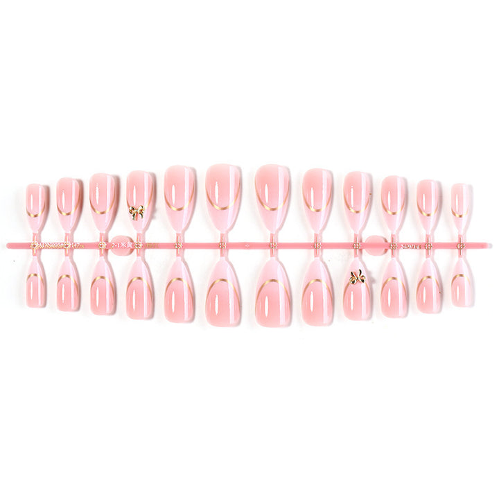 Artificial nail set with elegant gold edge and decorative accents Stornfield