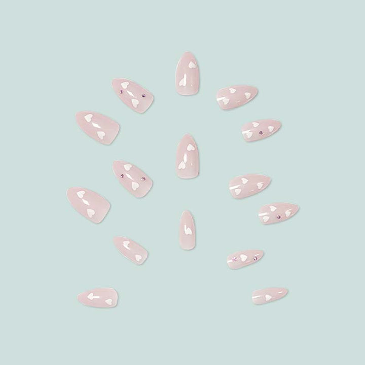 Decorative artificial nails with heart motif and rhinestones Stornfield