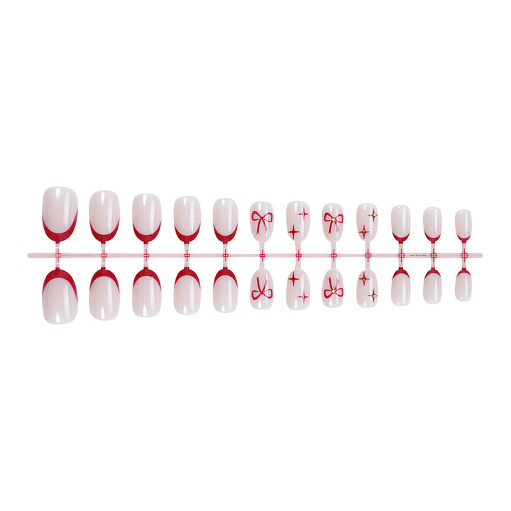Acrylic nail set with elegant arch design and glitter effects Stornfield