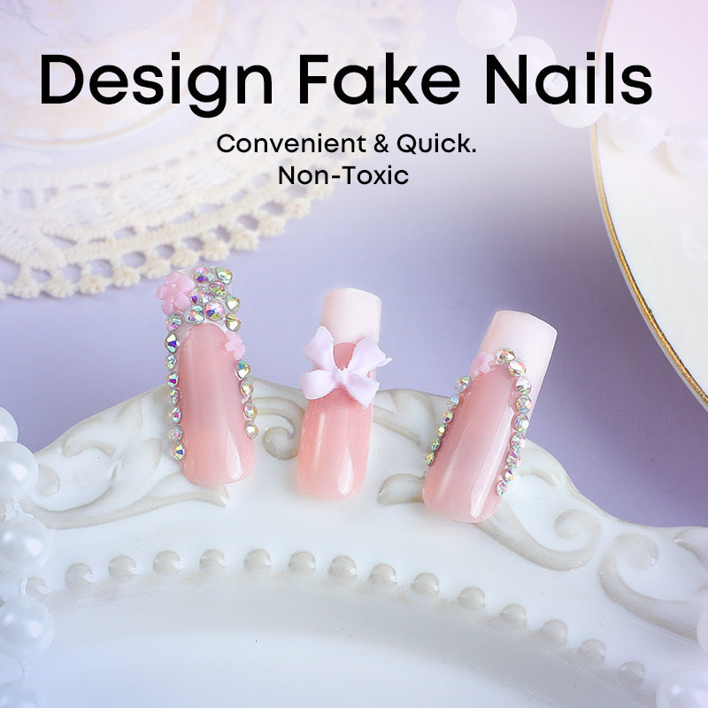 Artificial nail set with careful ribbon and glitter decorations Stornfield