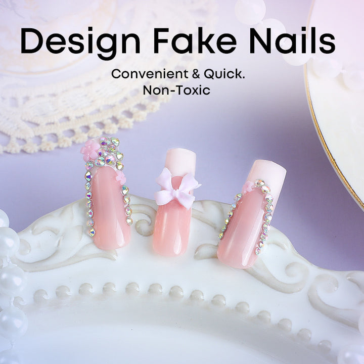 Artificial nail set with careful ribbon and glitter decorations Stornfield