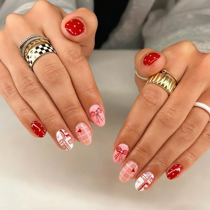 Artificial nail set with charming heart and bow patterns Stornfield
