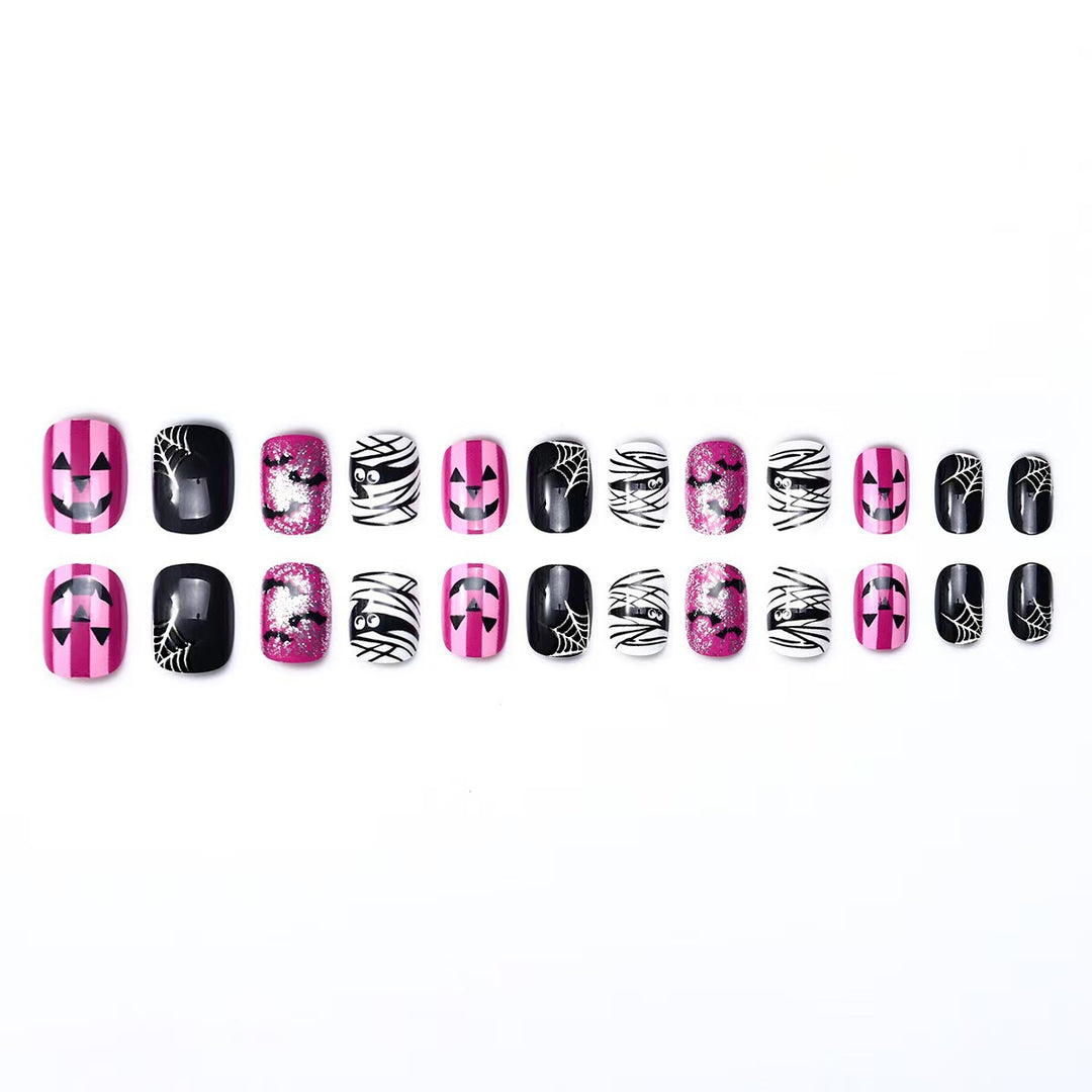 Creative nail art set with Halloween motifs and glitter accents Stornfield