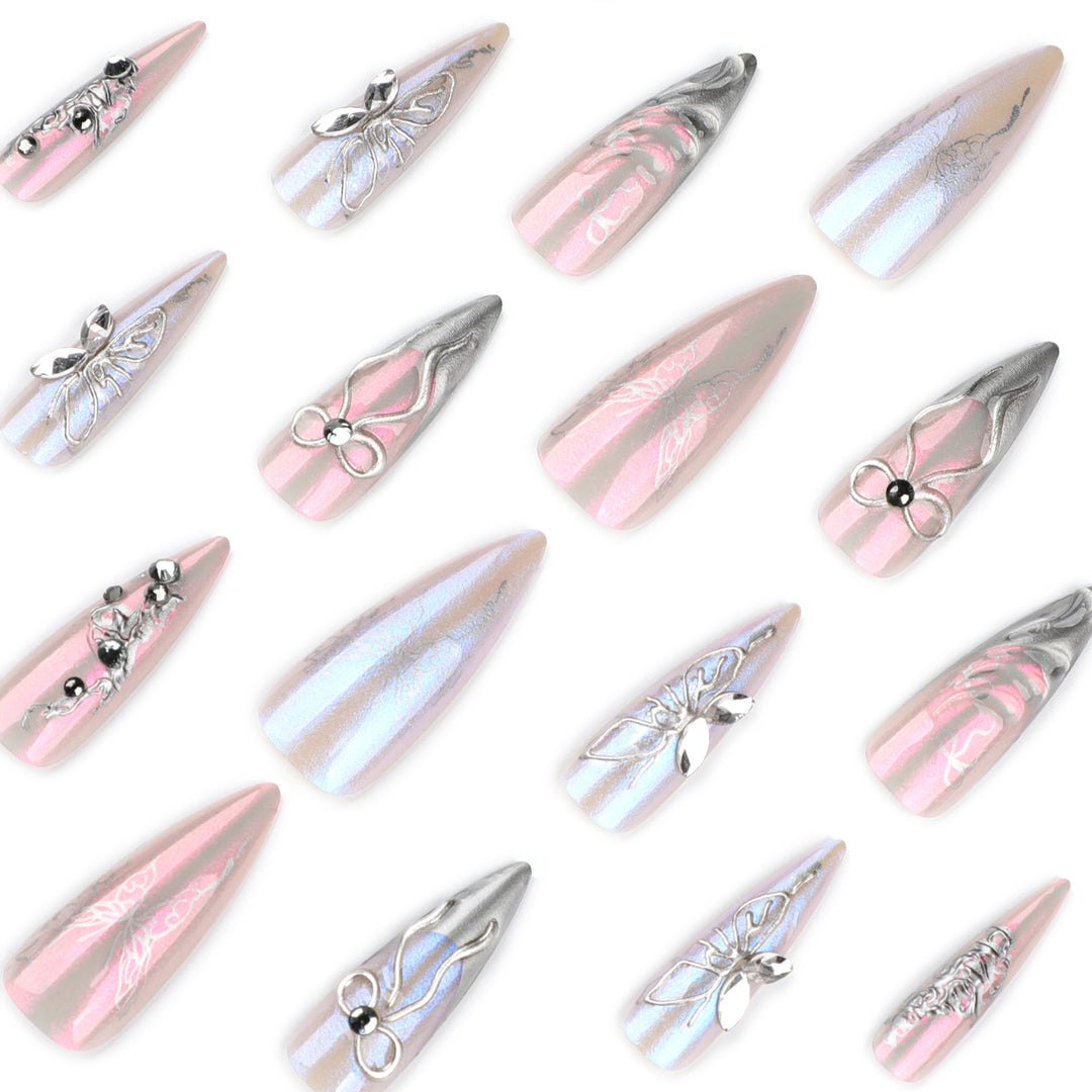 Artful stiletto nails with delicate silver casting decoration Stornfield