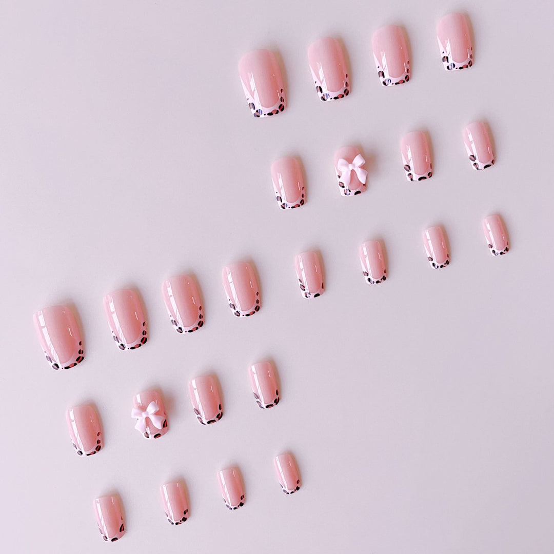 Artificial nail set with elegant leopard design and cute bows Stornfield