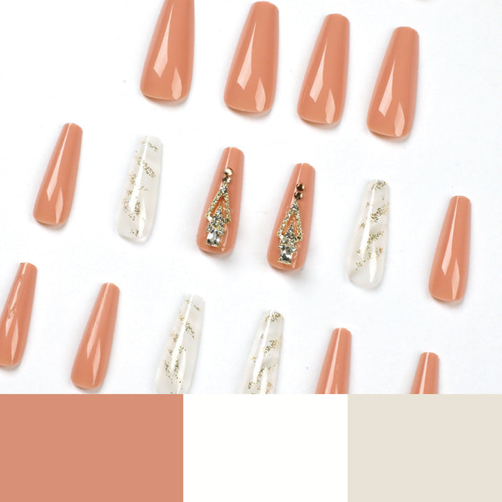 Artful nail extensions with glitter embellishments and delicate accents Stornfield