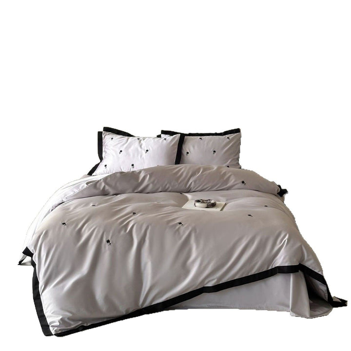 Elegant satin bed set with fine cherry embroidery and contrasting piping