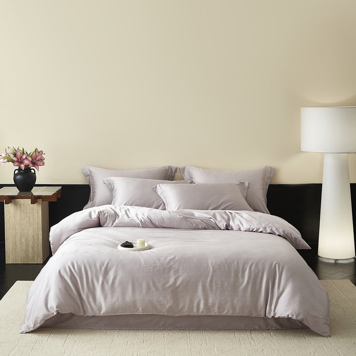 Satin bedding set with silky feel, hotel closure and tone-on-tone pattern