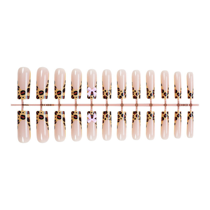 Decorative Stiletto Press-On Nail Art with Animal Print and Bow Accents Stornfield