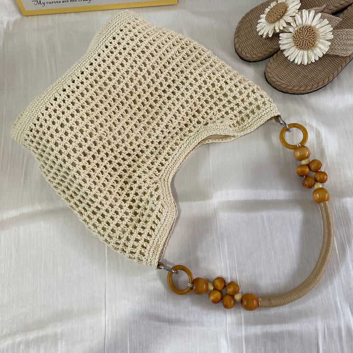 Hand-knotted tote bag with decorative wooden handle Stornfield