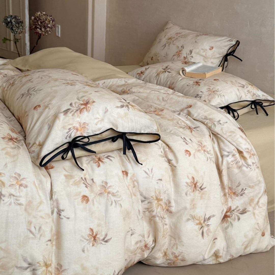 Bedding set made of cotton-linen with delicate watercolor floral print and decorative tying ribbons