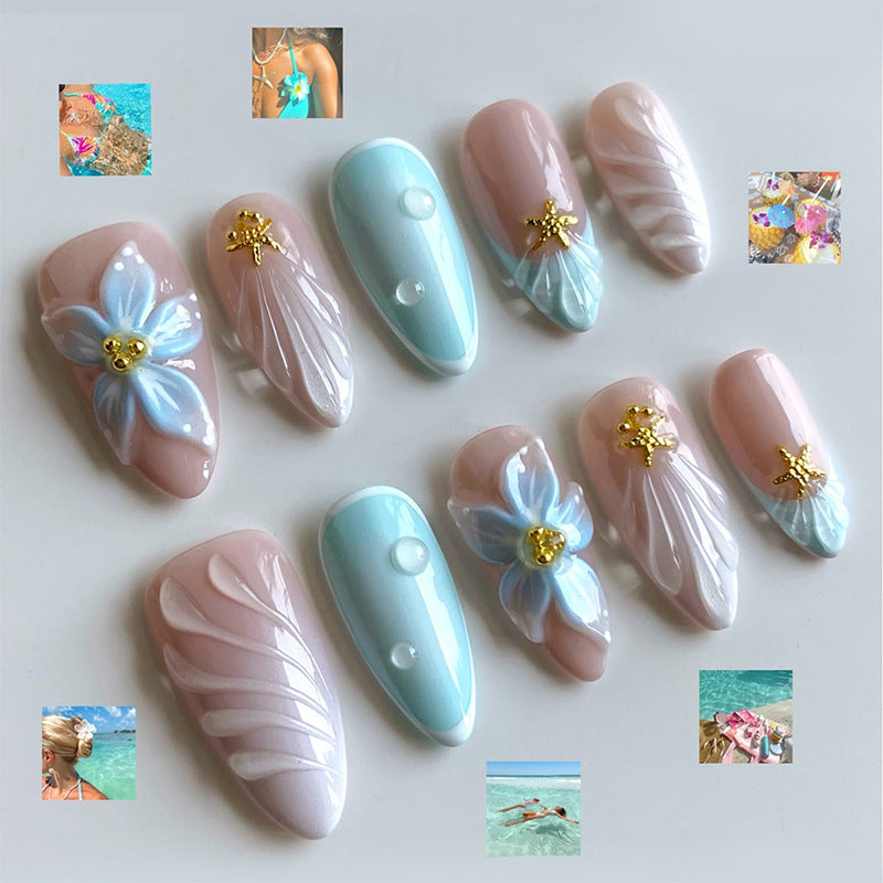 Artificial nail set with floral design and artistic embellishments Stornfield