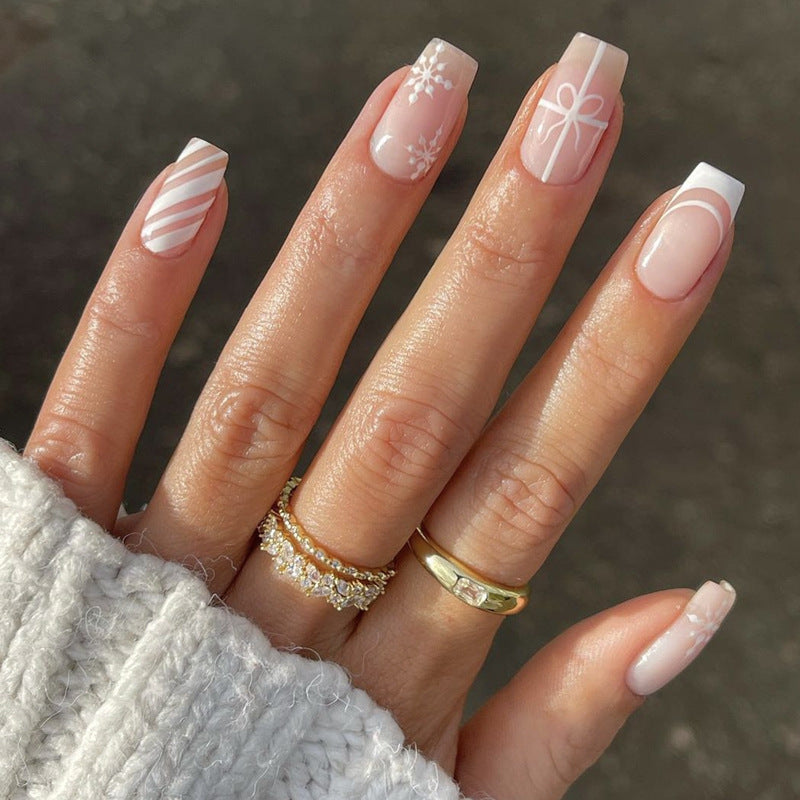 Nail set with elegant floral and striped designs Stornfield