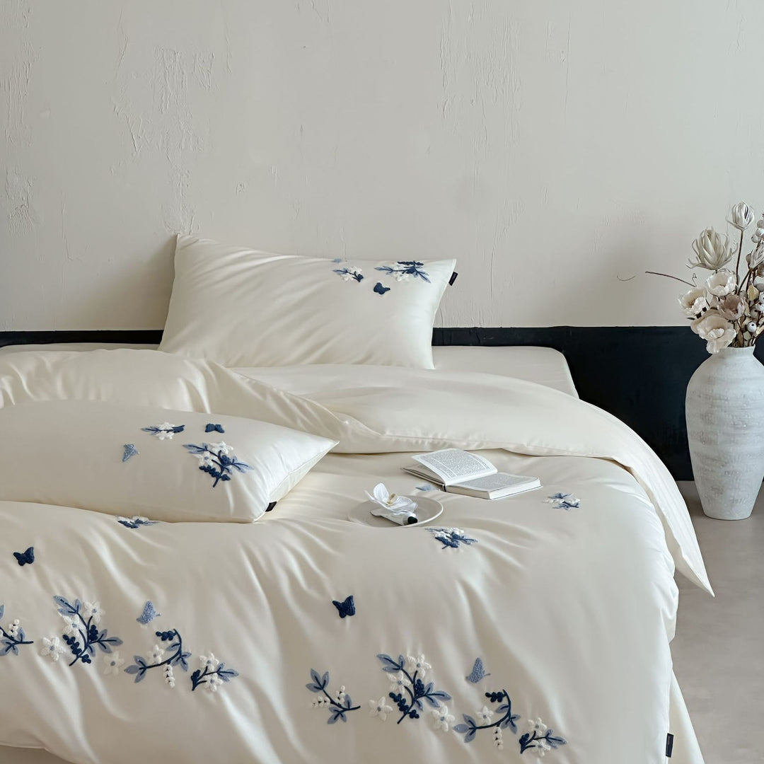 Luxurious satin bedding set with blue flower embroidery