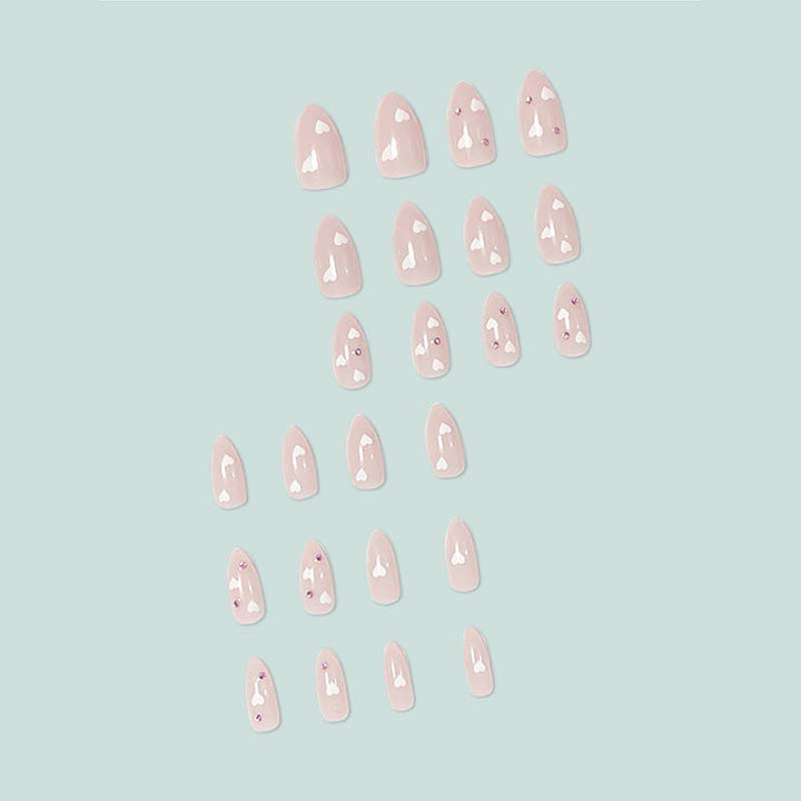 Decorative artificial nails with heart motif and rhinestones Stornfield
