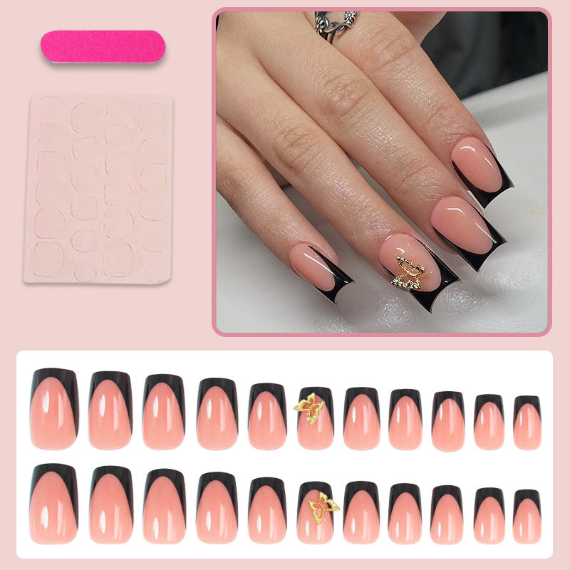 Artificial nails with elegant black and white tips and delicate accents Stornfield