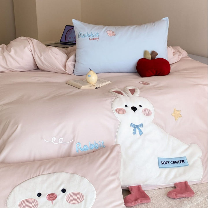 Children's bedding set with appliquéd duck figure, embroidered details, and extra soft microfiber cover