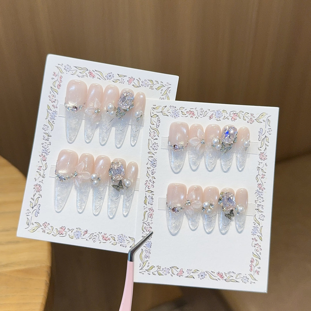 Artificial nails with delicate glitter and pearl decoration Stornfield