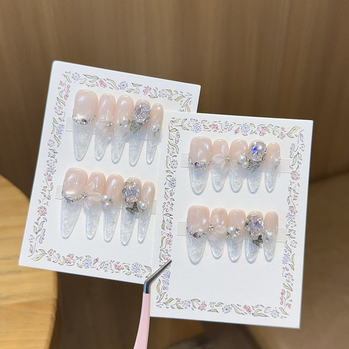 Artificial nails with delicate glitter and pearl decoration Stornfield